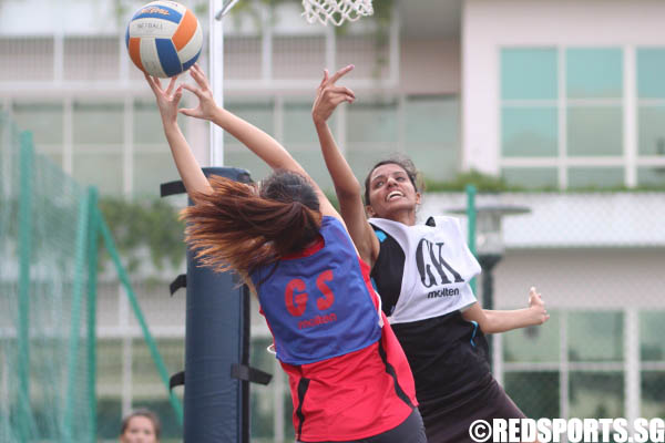 The GK of SP tipping the ball away from the GS of TP.