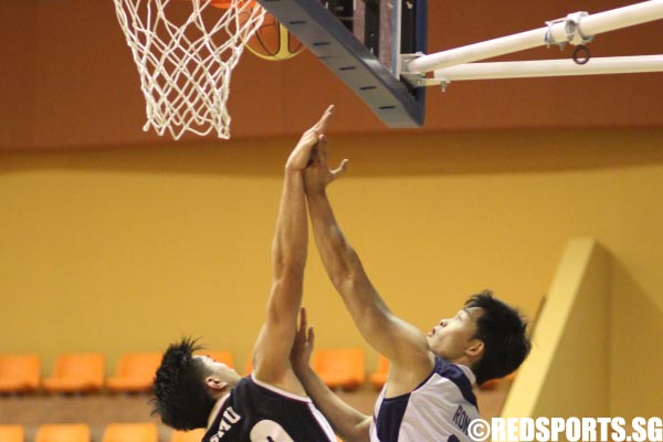 Ron Teh (SIM #6) going up to the basket against Nathanael Goh (SMU #20) who tries to block it 