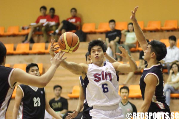 Ron Teh (SIM #6) trying to grab the loose ball 