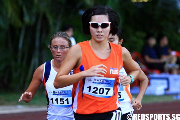 Clara wong (#1207) of NUS finishing 1st with a time of 11:14.41.