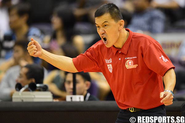 Slingers coach Neo Beng Siang shouts instructions to the players during the game.