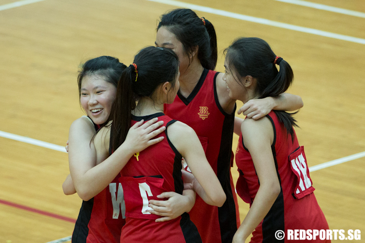 Yang Shuli (WD) of Hwa Chong Institution shares a moment with her teammate after winning Anglo-Chinese Junior College 54-53. (Photo © Lee Jian Wei/Red Sports)