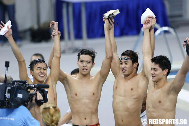 (L-R) Quah Zheng Wen, Danny Yeo, Clement Lim and Joseph Schooling won gold in the men's 4x100m freestyle relay. They clocked a time of 3 minutes and 19.59 seconds to set a new Games record. (Photo © Lee Jian Wei/Red Sports)