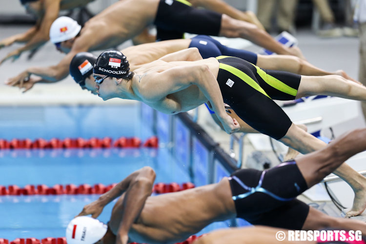 Joseph Schooling of Singapore jumping off the starting block during the Men's 100m butterfly final. (Photo © Lee Jian Wei/Red Sports)