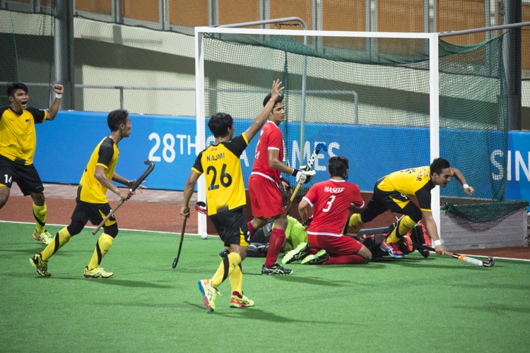 Malaysia celebrates their second goal through Abdul Rahman Azwar (#9).