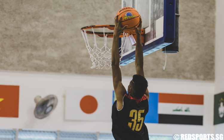 Shiek Ridwan of SKC attempting a dunk during the U-17 boys' 3 x 3 basketball competition of the Singapore Youth Olympic Festival. (Photo 18 © Soh Jun Wei/Red Sports)