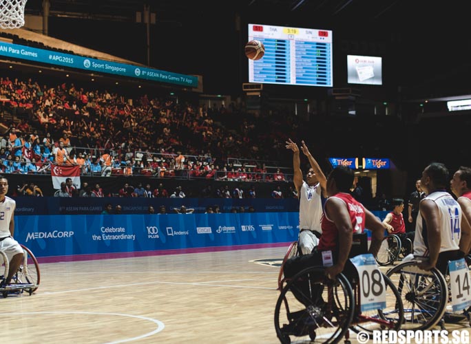 Athin Singdong (THA #11) shoots a free throw during the wheelchair basketball game at the 8th ASEAN Para Games. (Photo 7 © Soh Jun Wei/Red Sports)