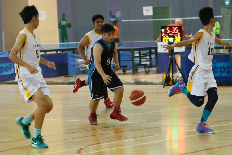 Chong Jun Hao (#9) weaving his way through the Tanglin defense on a fast break.