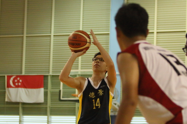 Northland's Yu Heng (Blue #14) attemting a free throw.