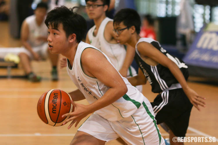 Calvin Lai (CCS #8) dribbles upcourt after catching a rebound. (Photo 9 © REDintern Chua Kai Yun)