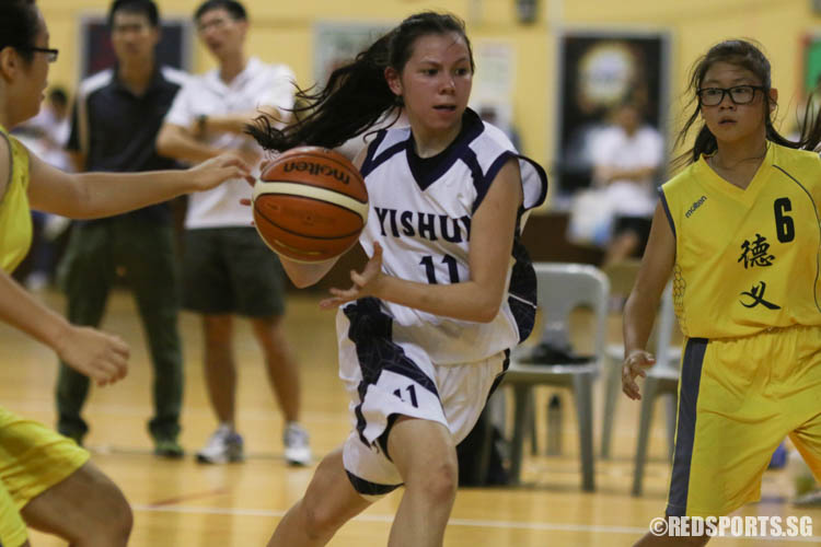 Regina Schiele (Yishun #11) prepares for a lay-up. She scored a team high 11 points. (Photo 2 © REDintern Chua Kai Yun)