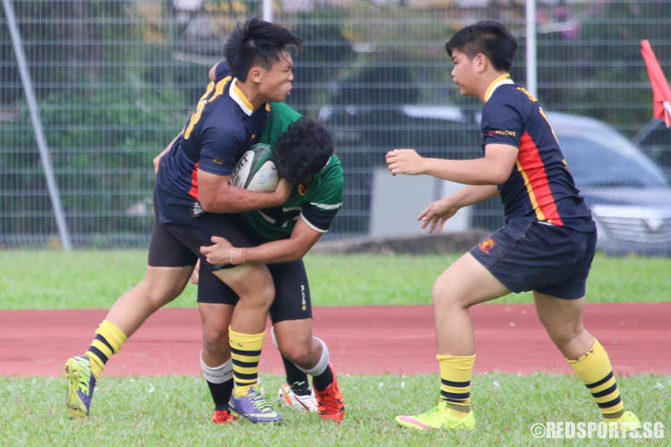 Gareth Lim [ACS(BR) #23] was tackled by his opponent Zuriel Chua (RI #17). (Photo 3 © REDintern Chua Kai Yun)