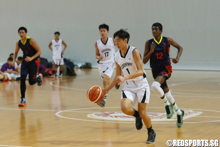 #1 of Queensway driving to the hoop on a fast break.  (Photo  © Chan Hua Zheng/Red Sports)