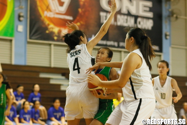 Valentia Wong (Christ Church #7) is strongly defended as she drives to the basket. (Photo 14 © Dylan Chua/Red Sports)