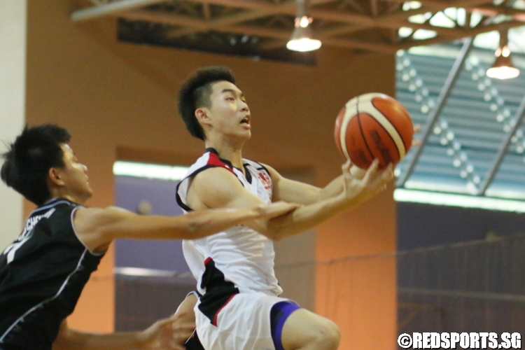 A Jurong player gets fouled on his way to the basket. (Photo 6 © Dylan Chua/Red Sports)