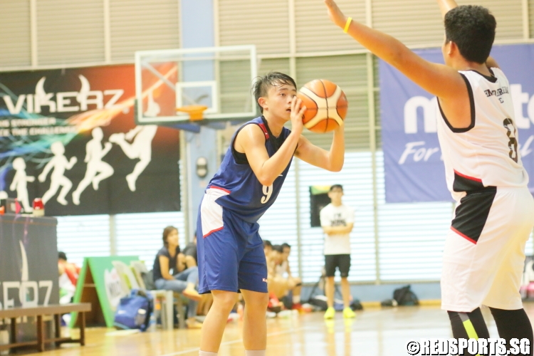 Sebas (Maris Stella #9) takes aim at the basket against Ahmad Ibrahim. (Photo 10 © Dylan Chua/Red Sports)