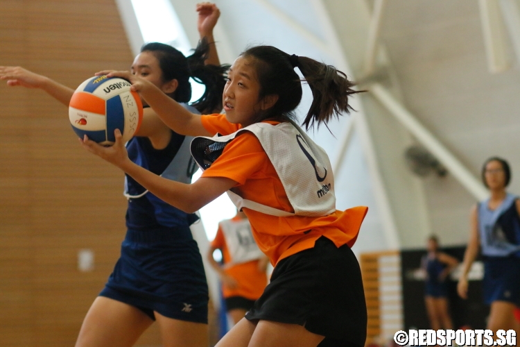 Yi Lin (NV C) grabs the ball over her outstretched opponent. (Photo 2 © Dylan Chua/Red Sports)