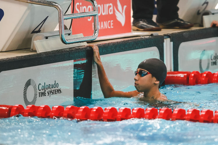 Christian Low checking his timing after the Boys 11-12 Year Olds 200m Backstroke. He finished first in the Boys 12 Year Olds group with a final timing of 2:33.80. (Photo 9 © Soh Jun Wei/Red Sports)