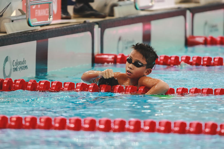 Zachary Tan cheering after he finished first in his heat. He would go on to place second in the Boys 12 Year Olds 200m Backstoke with a timing of 2:37.13. (Photo 5 © Soh Jun Wei/Red Sports)