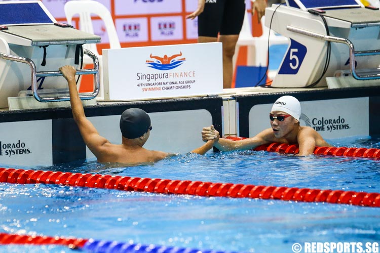 Jonathan Tan and Glen Lim sharing a moment after the race as they congratulated one another for meeting the Junior Pan Pacific B Timing. (Photo © Soh Jun Wei/Red Sports)