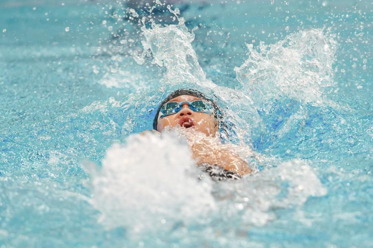 Reagan Cheng swims in the boys' 8-12 year old 50m backstroke. He won first place in the 8 year old group with a timing of 41.92s. (Photo © Soh Jun Wei/Red Sports)