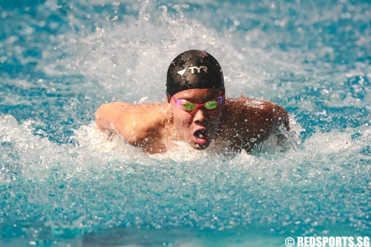 Mikkel Lee swimming in the mens' 13 and over 50m butterfly prelims at the 47th Singapore National Age Group Swimming Championships. (Photo © Soh Jun Wei/Red Sports)