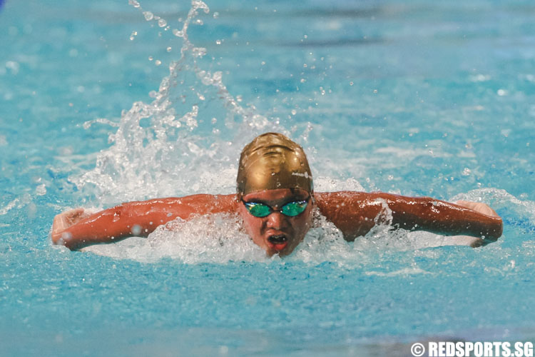 Ng Hong Jun in action in the mens' 13 and over 50m butterfly prelims at the 47th Singapore Natioinal Age Group Swimming Championships. (Photo © Soh Jun Wei/Red Sports)