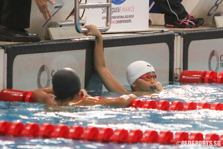 Ewan Pedersen Lee reacts after his 50m backstroke race. He finished first among the 9 year olds with a timing of 37.80. (Photo 5 © Chua Kai Yun/Red Sports)