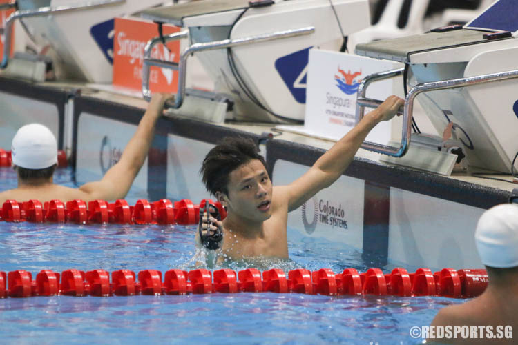 Dylan Koo, 17, reacts after his 50m butterfly race. (Photo 6 © Chua Kai Yun/Red Sports)