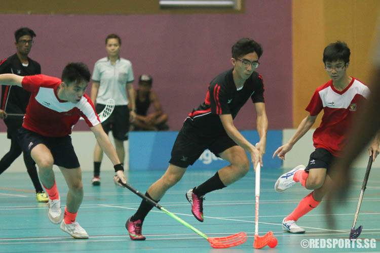 Ryan Tan (TPJC #21) controls the ball under pressure from ACJC. (Photo © Chua Kai Yun/Red Sports)