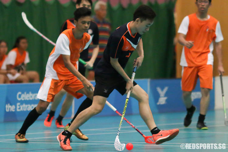 Chen Hui Long (PJC #18) steers the ball away from his opponent. (Photo © Chua Kai Yun/Red Sports)