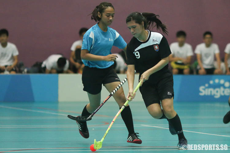 Nadia Bte Mohd Ali (NYJC #9) controls the ball against Millennia Institute. (Photo © Chua Kai Yun/Red Sports)