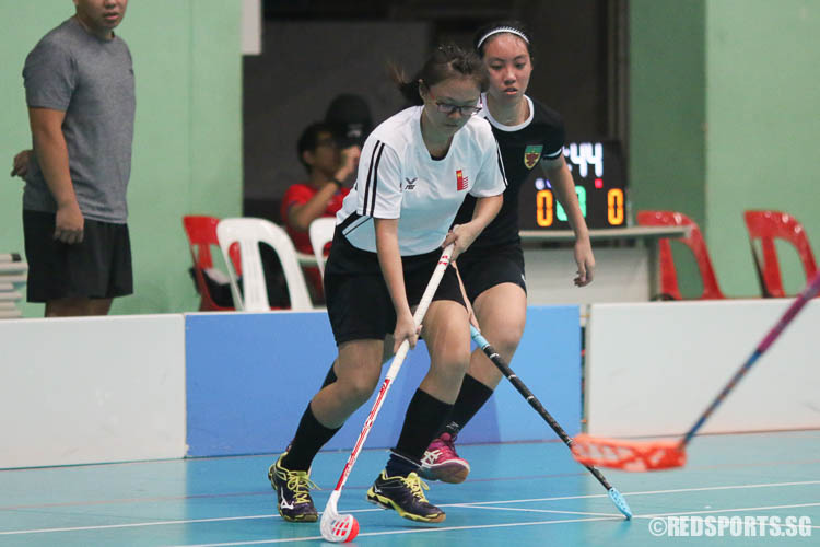 Yan Jing Hua (NJC #66) dribbles against RJC.  (Photo © Chua Kai Yun/Red Sports)