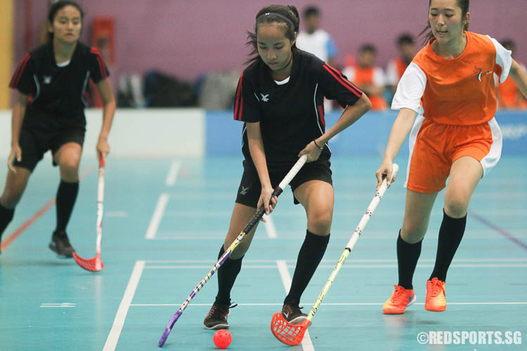 Nur Amanina Bte Mohammad Fuad (TPJC #24) controls the ball against IJC. (Photo © Chua Kai Yun/Red Sports)