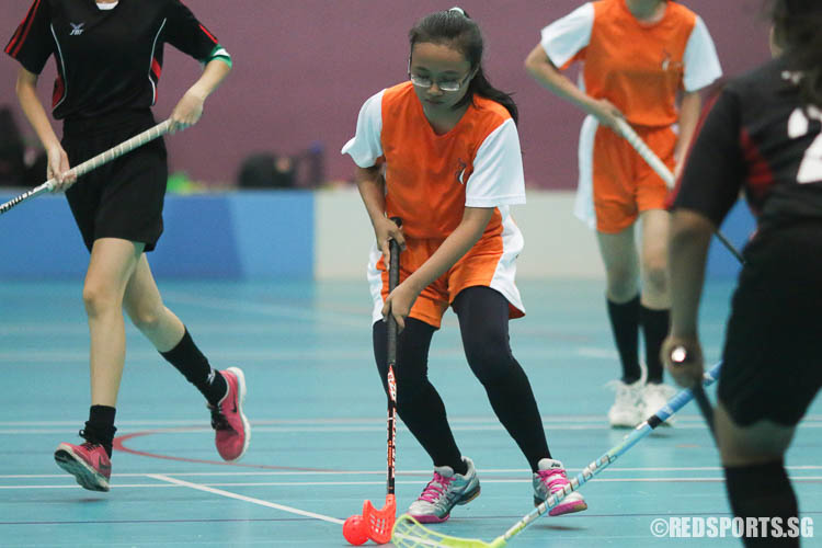 Suraya Bte Suhairi (IJC #19) controls the ball under pressure from TPJC. (Photo © Chua Kai Yun/Red Sports)