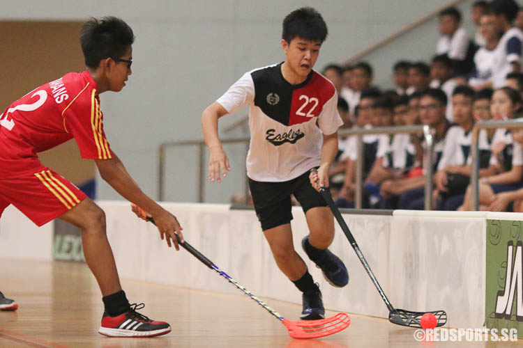 Don Heng (EVS #22) dribbles the ball under pressure from Muhammad Zaidan B Abdul Wahab (BMS #22). (Photo © Chua Kai Yun/Red Sports)