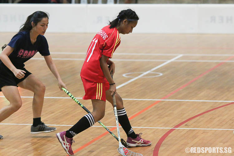 Nureen Farishah (BM #11) dribbles the ball against Coral Secondary. (Photo © Chua Kai Yun/Red Sports)