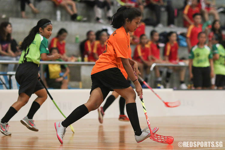 Yasmin Namira Bte Mohammade Y (TKSS #36) dribbles the ball against Orchid Park Secondary. (Photo © Chua Kai Yun/Red Sports)