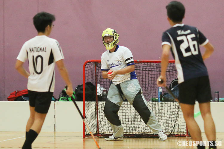 Jerram Anthon Liaw (#25) of CJC looks to pass after saving a shot by NJC. (Photo © Chua Kai Yun/Red Sports)