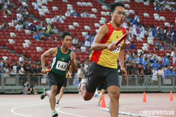 Jeremy Png (#265) of HCI and Ryan Tan (#148) of RI running the first leg of the A Division Boys 4x400m relay final. (Photo © Chua Kai Yun/Red Sports)