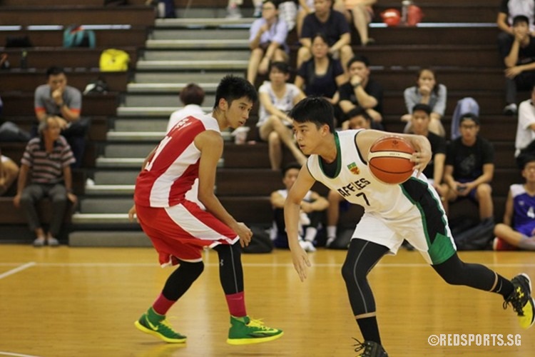 Tristen Zheng (RI #7) dribbles past his marker.