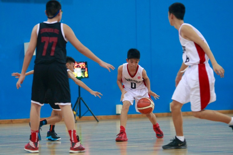 HCI (white) had a comfortable 82-8 win over Zhenghua to improve to a 2-0 win-loss record. (Photo © Les Tan/Red Sports)