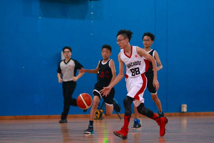 HCI (white) had a comfortable 82-8 win over Zhenghua to improve to a 2-0 win-loss record. (Photo © Les Tan/Red Sports)