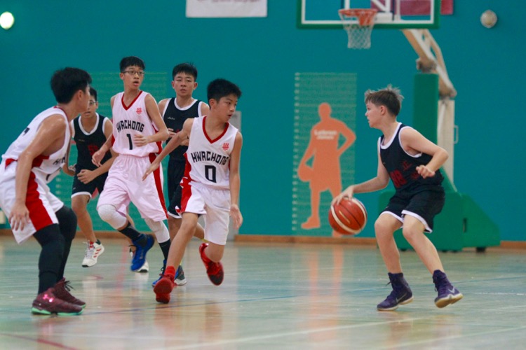 HCI (white) had a comfortable 82-8 win over Zhenghua to improve to a 2-0 win-loss record. (Photo © Les Tan/Red Sports)