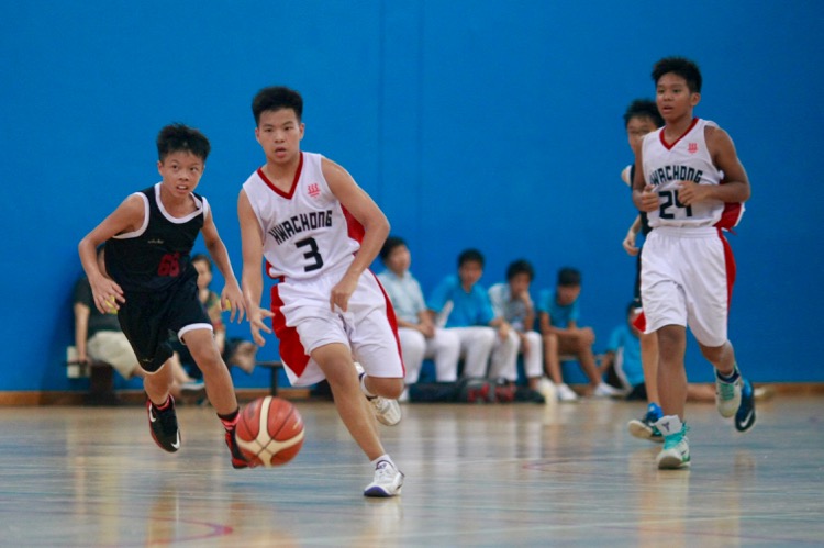 HCI (white) had a comfortable 82-8 win over Zhenghua to improve to a 2-0 win-loss record. (Photo © Les Tan/Red Sports)