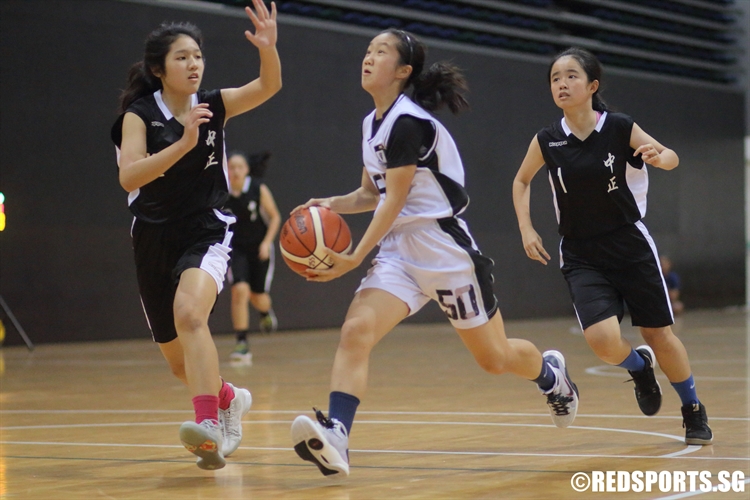 Nicole Tng (RGS #50) at full speed on a drive to the basket. She scored six points against Chung Cheng High (Main). (Photo 3 © Dylan Chua/Red Sports)