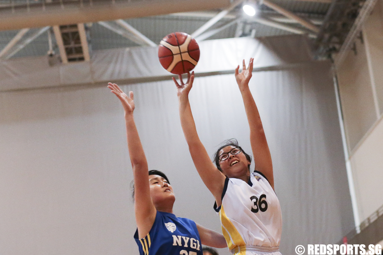 Toh Wang Xin (#36) of Guang Yang Secondary shoots against Zann Siow (#37) of Nanyang Girls. (Photo © Lee Jian Wei/Red Sports)