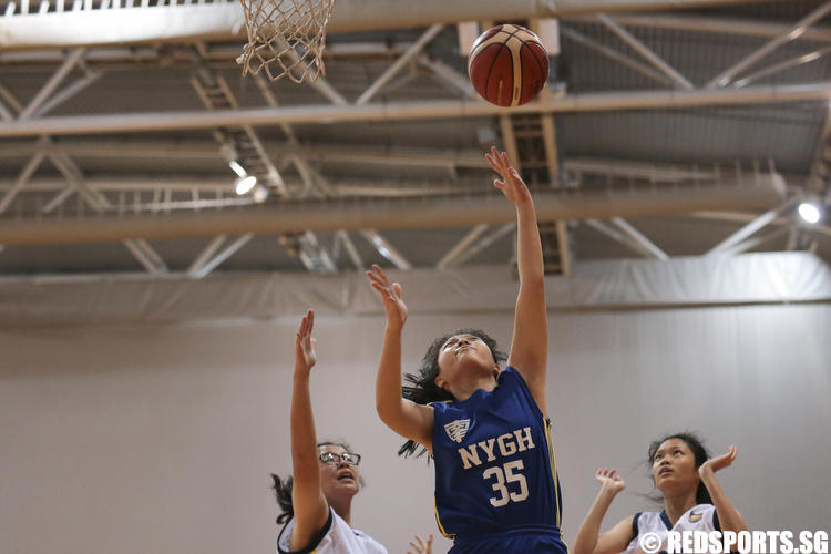 Michelle Heng (#35) of Nanyang Girls shoots a layup against Guang Yang Secondary. (Photo © Lee Jian Wei/Red Sports)