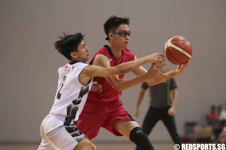 Ryan Hoa (#2) of Unity Secondary and Joseph (#7) Dunman High fights for possession of the ball. (Photo © Lee Jian Wei/Red Sports)