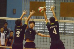 Jordan Ryan (GMS #5) attempts to spike one past the XMS blockers. (Photo 12 © REDintern Nathiyaah Sakthimogan) 